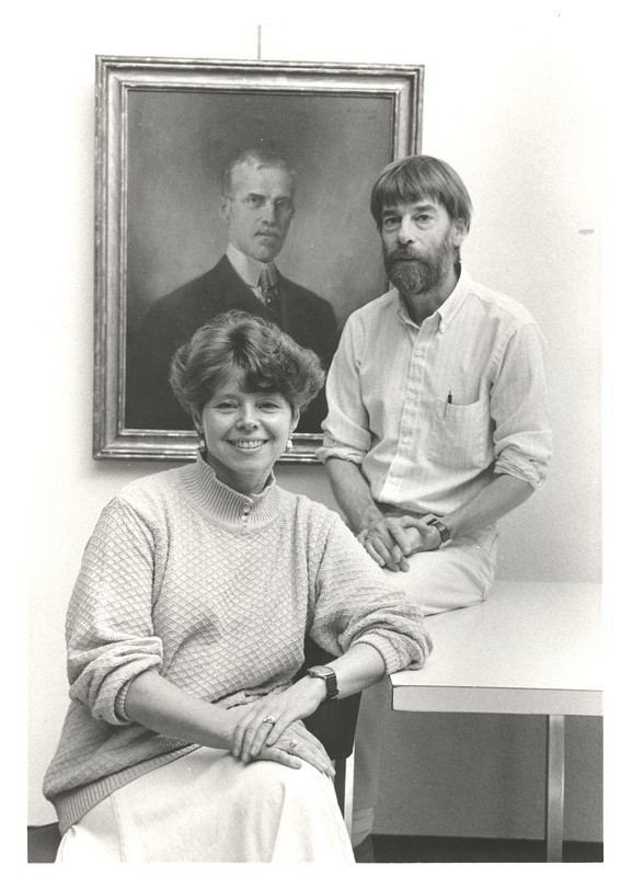 Marcia and Owen in front of a portrait of C. G. Mile, c. 1980