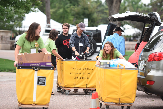Group of students moving in with yellow carts