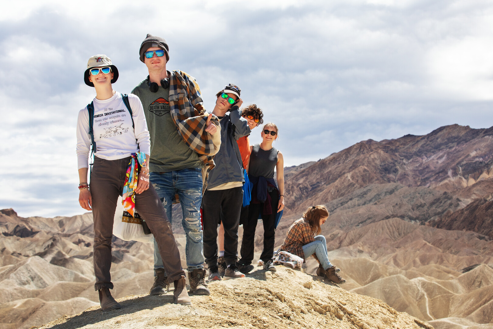Audra Burral '23, Hunter Markowich '26, Wade Noelke '24, Jesus Lara Rivas '25, Ahnalysse Wyland-Olberding '25, and Mia Degner '24, standing on a cliff in Death Valley, California, during their spring break road trip with Outdoor Ed on March 29, 2023. Photo by Mila Naumovska '26.