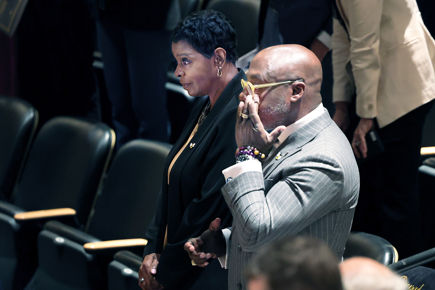 Michael Sawyer, the president's husband, wipes away a tear as he listens to Manya Whitaker speak. Seated next to Sawyer is Whitaker's mother, Michelle Whitaker. Photo by Jamie Cotten / Colorado College