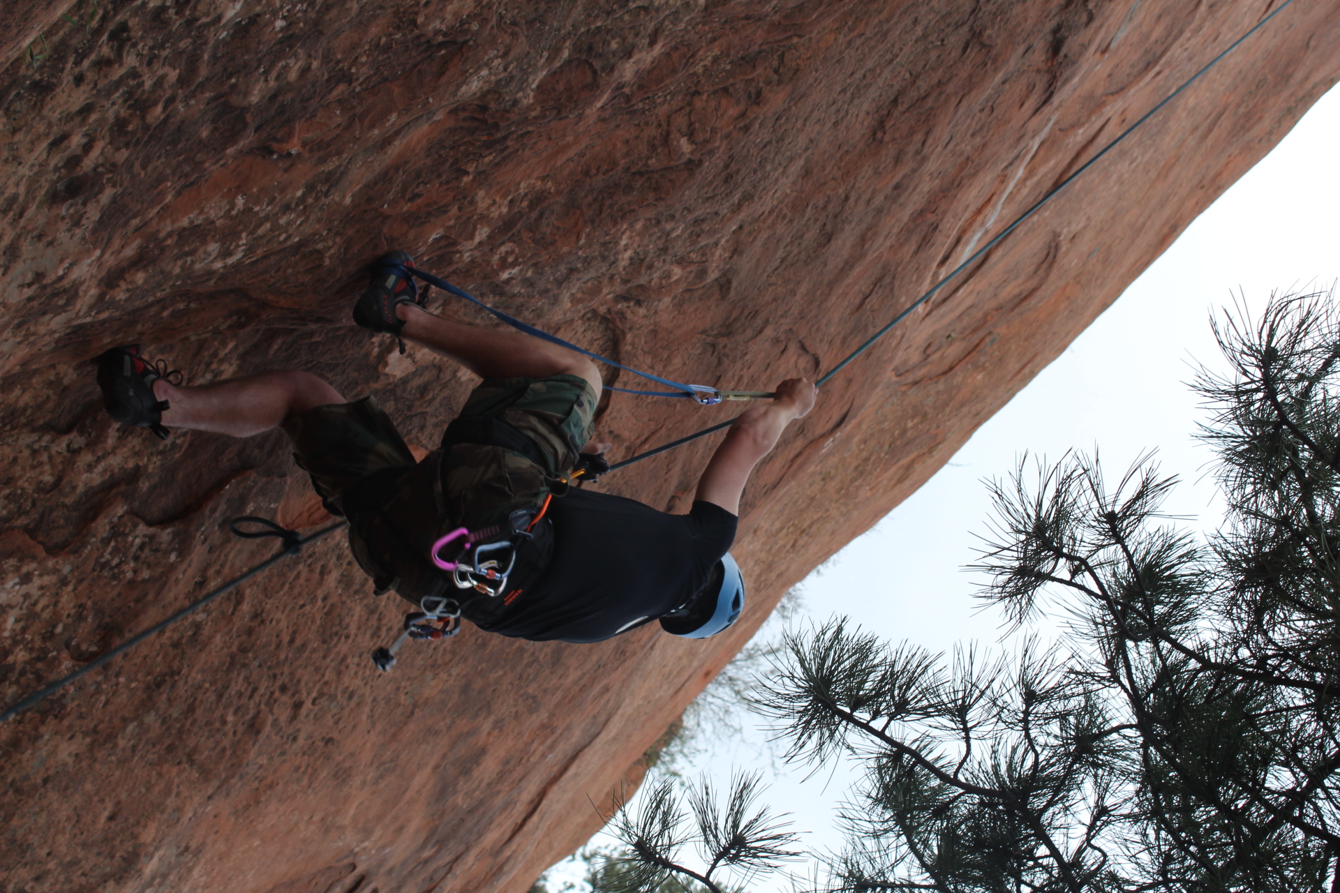 Photo of a Colorado College student rock climbing at Red Rocks Canyon Open Space