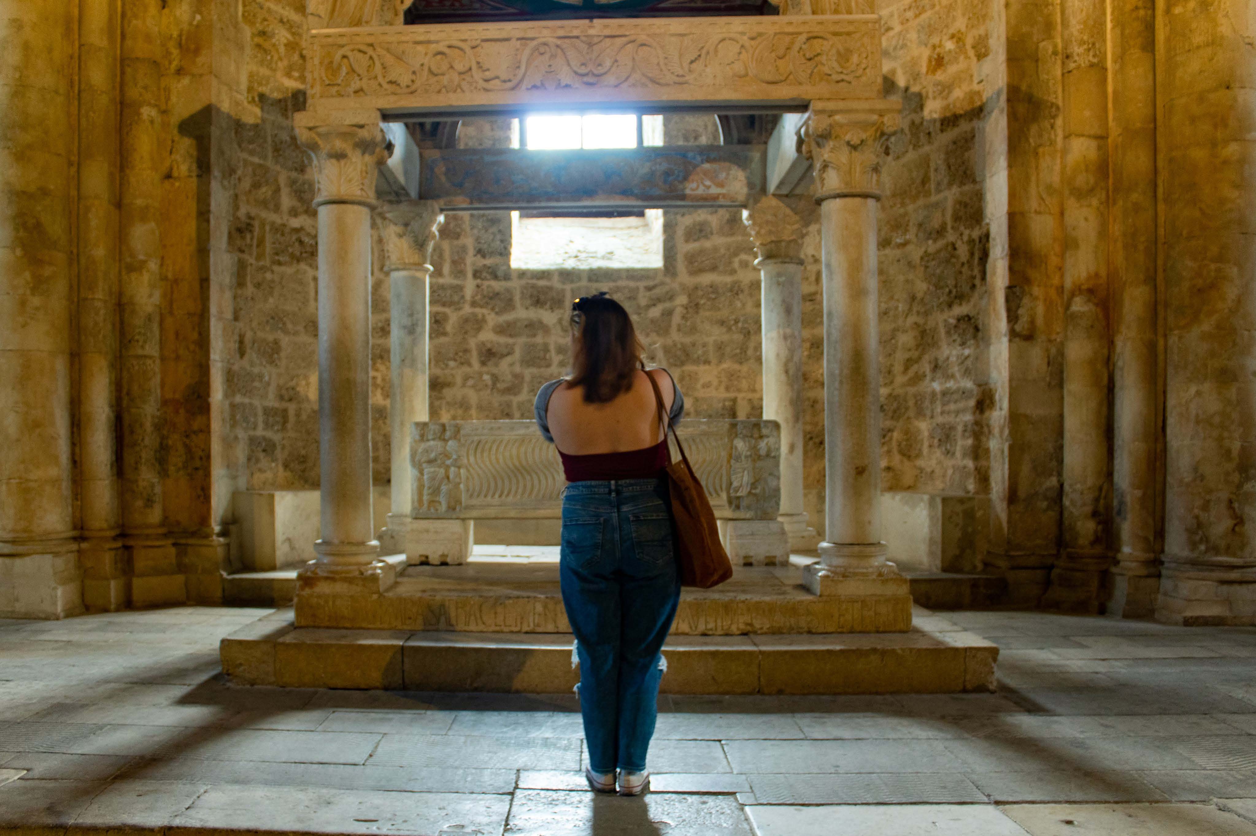 student looking at ancient artifact